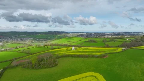 Rapeseed Fields and Farms over Torquay from a drone, Devon, England, Europe Vidéo 312444059