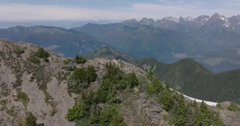 Rapid Aerial Push Over Ridge and Lake Stock Footage 313955589