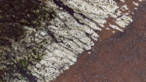 Rapid Aerial Spin Over White Cliffs and Textured Coastal Terrain Stock Footage 309764157