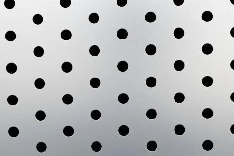 Rapid black dot pattern on gray background, round holes texture on perforated Stock Photos