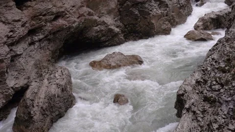 Rapid bubbling flow of a mountain river in a rocky gorge. Slow motion 240 fps Stock Footage 168177796