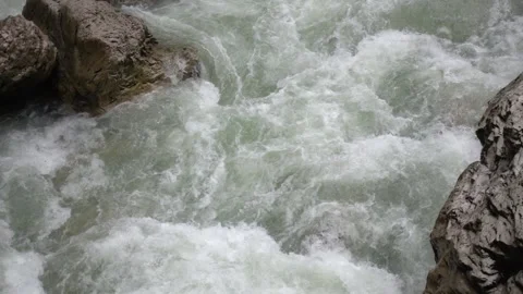 Rapid bubbling flow of a mountain river, top view. Slow motion 240 fps Stock Footage 168185456