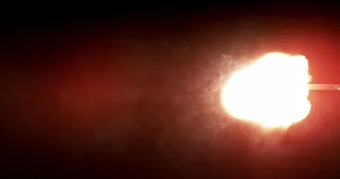 Rapid burst of multiple gun muzzle explosions isolated on black background. Stock Footage 327902848