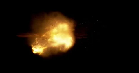 Rapid burst of multiple gun muzzle explosions isolated on black background. Stock Footage 335086594