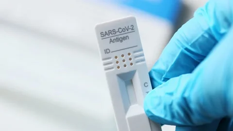 A rapid corona antigen test in one hand Stock-Footage 152104402