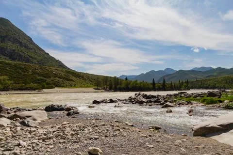 Rapid current of the Chuya River in Mountains Altai Stock Photos