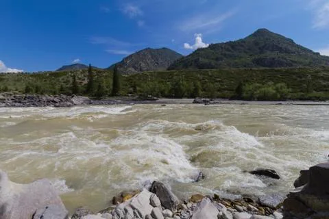 Rapid current of the Chuya River in Mountains Altai Stock Photos