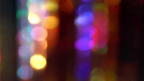 The rapid flickering of rainbow lights. Blurred background for the holiday Stock Footage 264452861