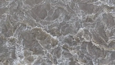 Rapid flow and bubbling of water in the river. Stockbeeldmateriaal 74946554
