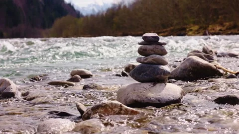 A rapid flow of a mountain river in the Alps. stones in a mountain river, stones Stock Footage 307870159