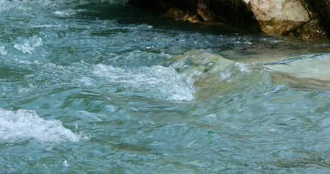 Rapid flow of a mountain river with emerald water close-up. Stock Footage 251832889