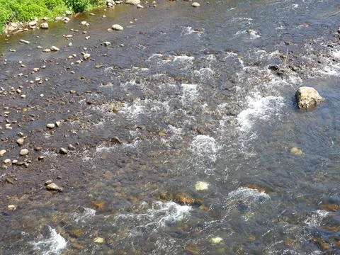 Rapid flow of the river. Big river, view from above. View from the bridge to  Stock Photos