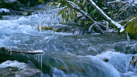 Rapid flow of water in a mountain river in winter. Stock Footage 85539730