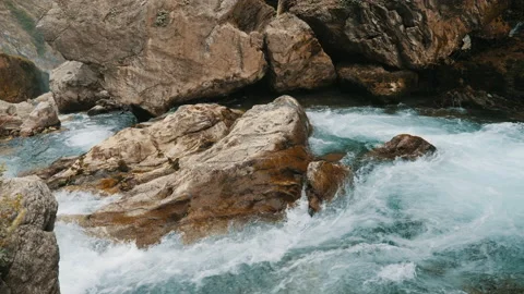 Rapid flow of water in a mountain river with rapids Stock Footage 162023289