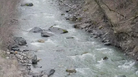 Rapid flow of water in mountain river 스톡 동영상 295037832