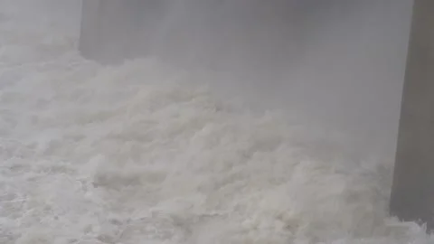 Rapid flow of water in a river at a hydroelectric power station Stock Footage 135833495