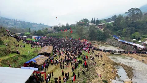 Rapid forward drone sweep over peak crowded moment of folk festival 4K Stock Footage 337916455