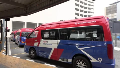 Rapid KL On-Demand shuttle buses parked at a designated transit facility in KL Stock Footage 342368933