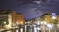 Rapid lightning forks flashing in rainy night sky above city, thunderstorm sound HD Footage