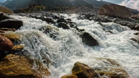 A rapid mountain stream among large rocks 動画素材 317705851