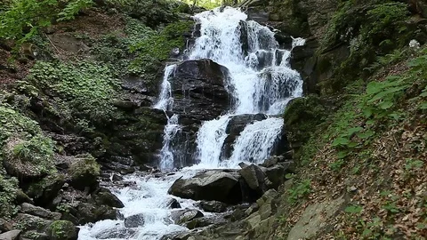 Rapid mountain stream and waterfall Stock Footage 76809635