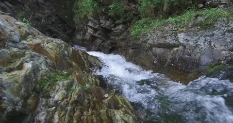 Rapid mountain stream between the rocks. Sliding camera. Ural Stock Footage 269539803