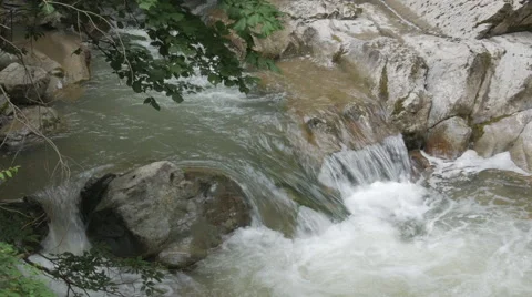 Rapid mountain stream flowing through big rocks. Stock Footage 55295536