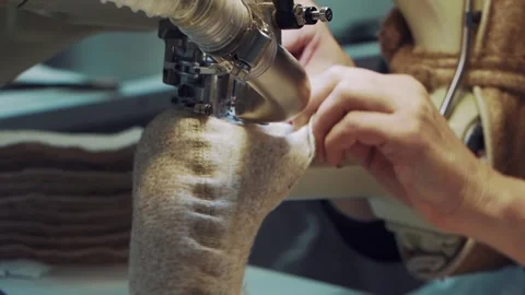 The rapid movement of the sewing machine needle through the fabric. Close-up Video stock 234189904