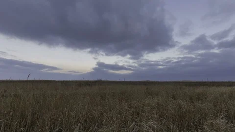 Rapid movement of winter storm clouds over the steppes Stock Footage 72546144