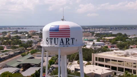 Rapid orbiting shot of water tower in city Stuart in Florida Stock Footage