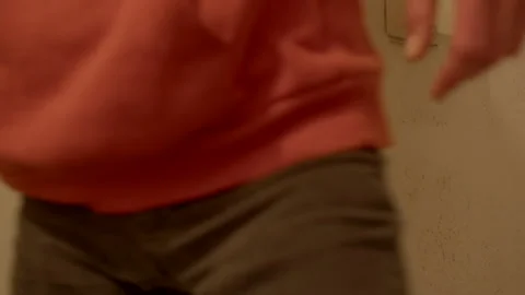 Rapid passage through door emphasized by brief dark frames and warm lighting Видео 322923427