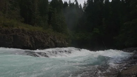 Rapid river current flowing down between the rocks Stock Footage 119157644