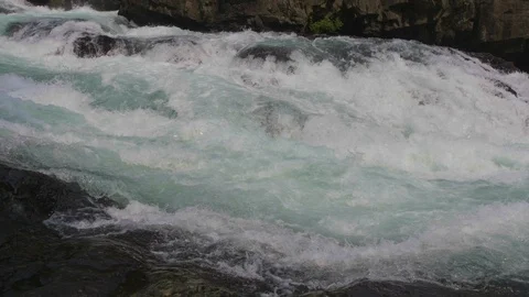 Rapid river current flowing down between the rocks Stock Footage 119159451