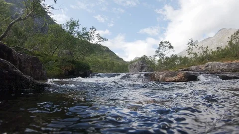Rapid river flow with mountain view. Raging mountain river. Stock Footage 119799297