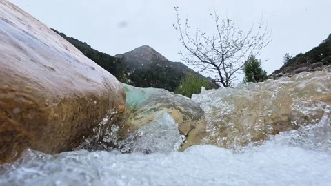 Rapid River Flowing Between Rocks with Mountain View Stock Footage 305236306