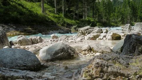 Rapid river flowing through the valley in the Italian Dolomites Stock Photos