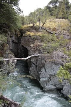 Rapid River getting between rocks. Nature landscape. Stock Photos