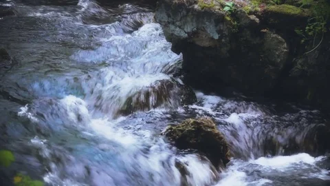 Rapid River Water Flows Past Wet Rocks Stock Footage 76939922