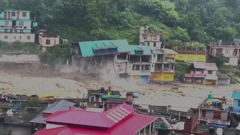 A rapid stream of muddy rain water entering in the river (Flood Disaster). Stock Footage 281310804