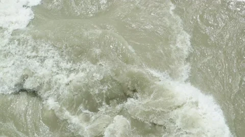 Rapid stream of muddy river Stock Footage 67711925