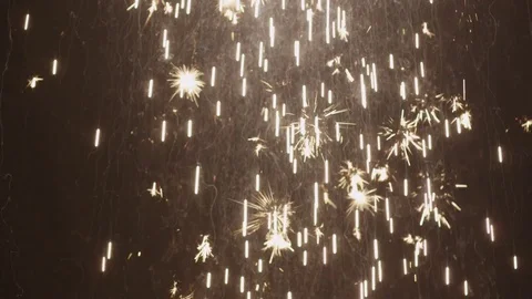 A rapid stream of sparks and fireworks begins crosses the screen Stock Footage 80950010