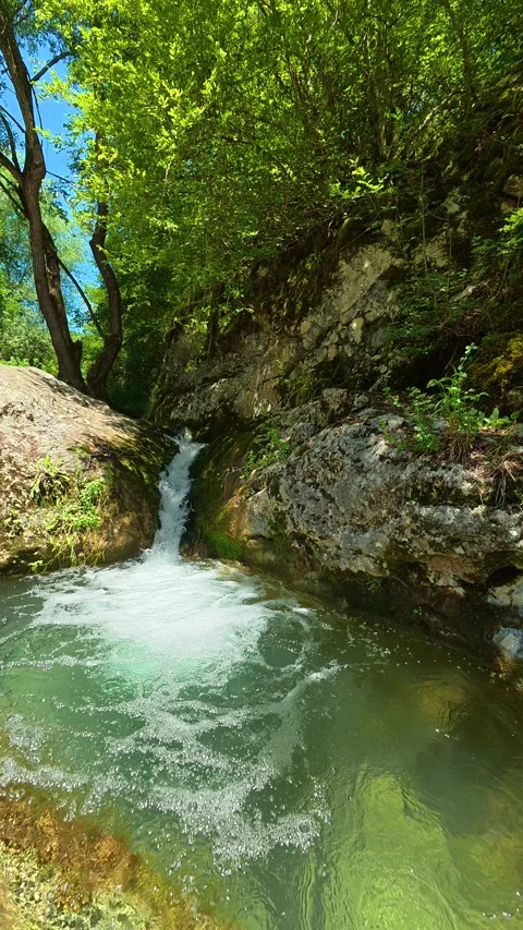 Rapid stream tumbles over rocks. Gradasnica River Canyon, Vertical Stock Footage 342327742