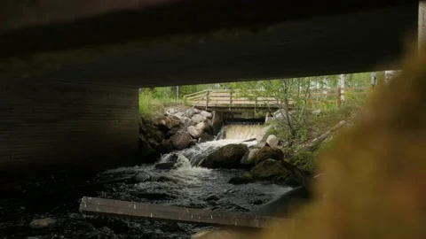 Rapid Stream Of Water Under Bridge Video stock 235169942