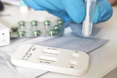 Rapid Test Kit for Flu and COVID-19 Detection in Medical Setting Stock Photos
