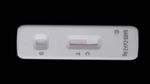 Rapid test kit shows the control line with negativ coronavirus result, isolated Video stock 168013948