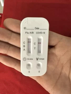 Rapid test kit for simultaneous detection of Influenza A/B and COVID-19 Stock Photos