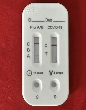 Rapid test kit for simultaneous detection of Influenza A/B and COVID-19 Stock Photos