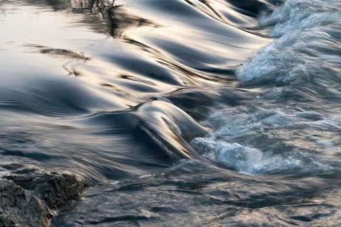 Rapid water flows in stream making cascades Stock Photos
