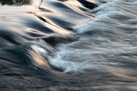 Rapid water flows in stream making cascades Stock Photos