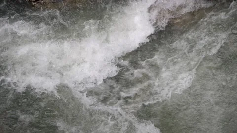Rapid water stream with white foam. Mountain river, slow motion 180 fps Video stock 168150351
